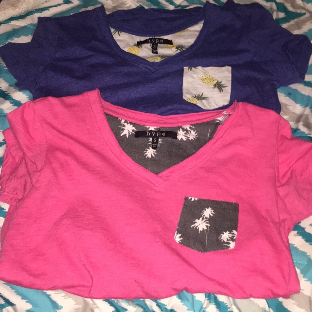two v-neck shirts . Pink and blue